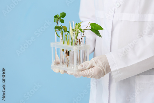 Scientist holding test tube...