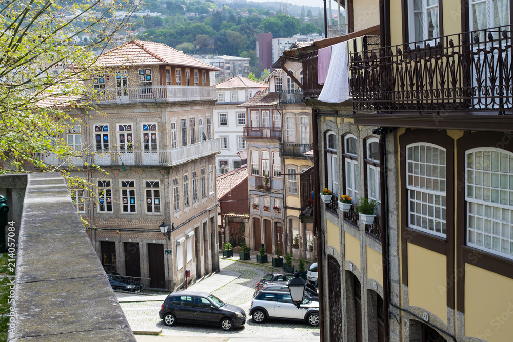 View between traditional buildings in Guimaraes, Portugal