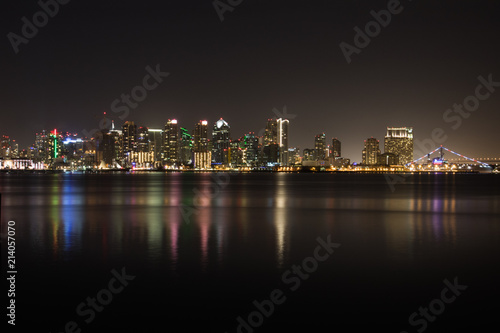 Horizontal Night Skyline of San Diego with lighted bridge  buildings and reflections