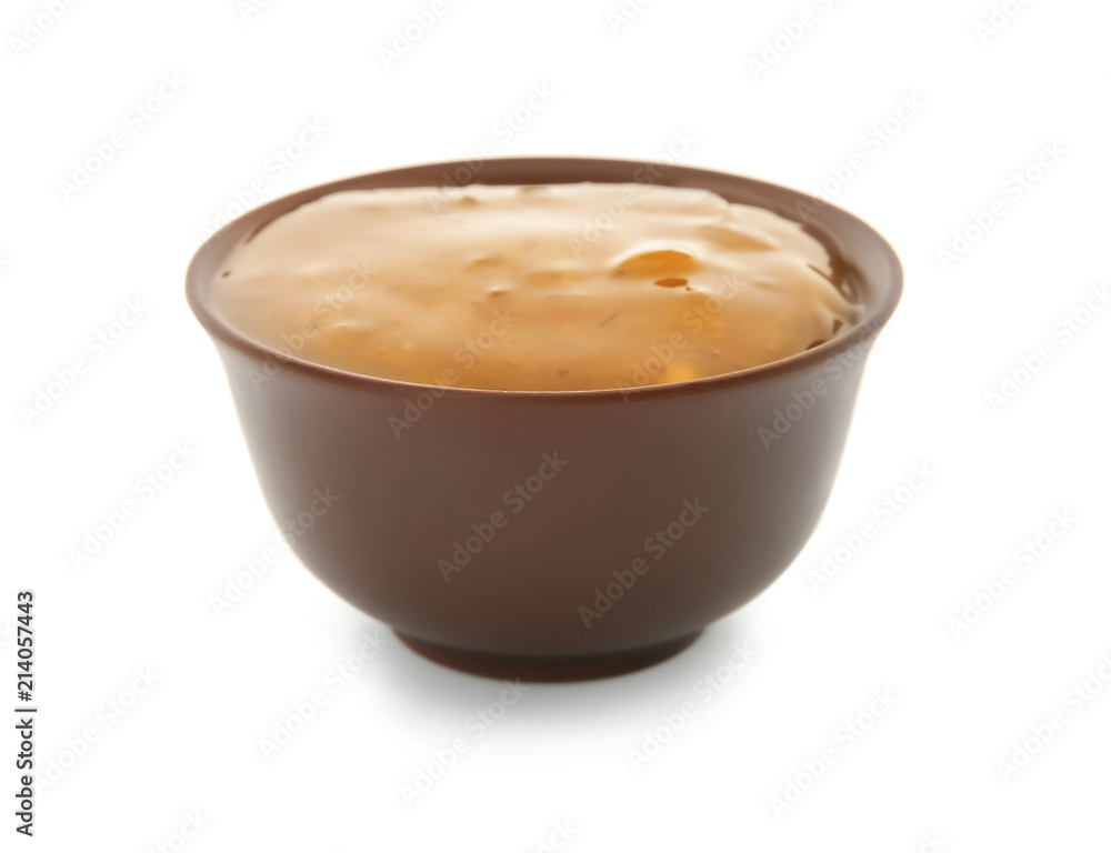 Tasty sauce with herbs in bowl on white background Tasty sauce with herbs in bowl on white background