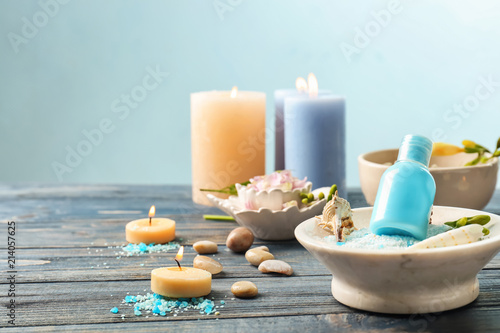 Spa treatments on table against light background