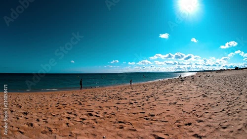 Young Dad And His Son On A Beach, Boy Running To Scare Away Birds