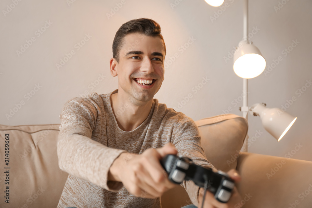 Young man playing video game at home Young man playing video game at home