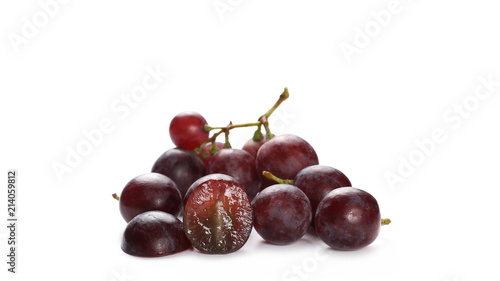 Cardinal grapes with halved slice isolated on white background