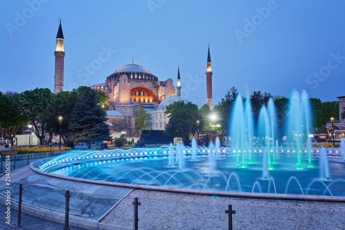 Hagia Sophia basilica in Istanbul, Turkey, with colorful illuminated fountains photo