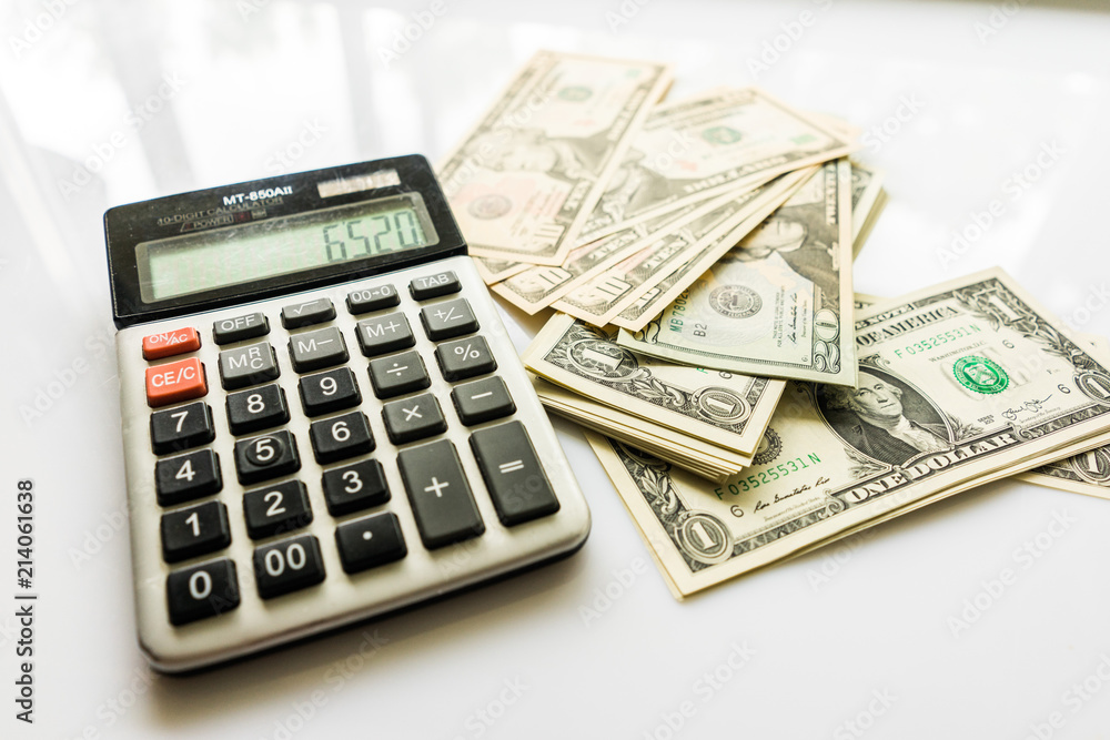 Close-up Money and Calculator, American Dollar Banknotes Close-up Money and Calculator, American Dollar Banknotes