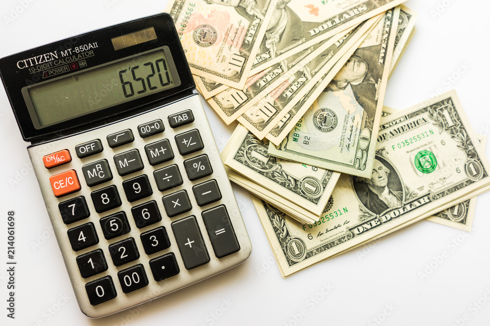 Close-up Money and Calculator, American Dollar Banknotes Close-up Money and Calculator, American Dollar Banknotes