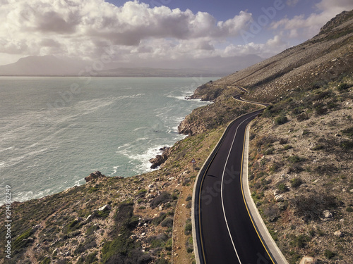 Winding coastal road in False Bay, South Africa. A scenic drive along the mountain to Gordons Bay