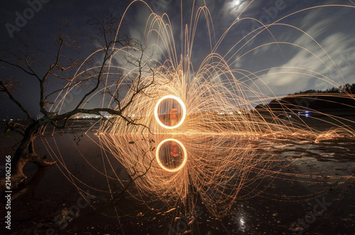 firework swing fire on dead tree fourground 