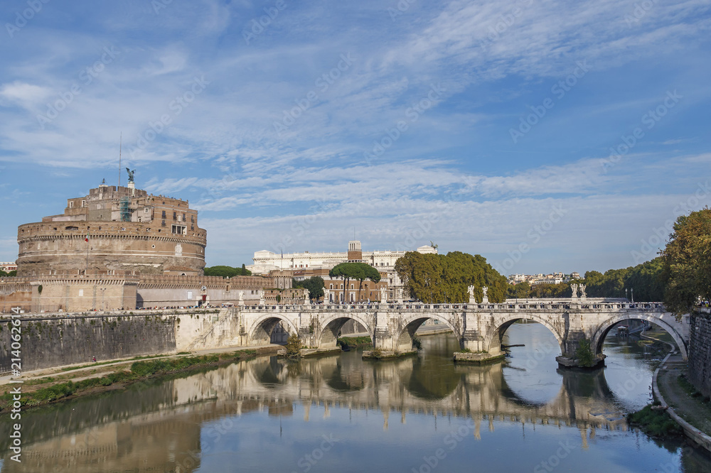 View of the bridge over the Tiber and the fortress of Santangelo against the blue sky