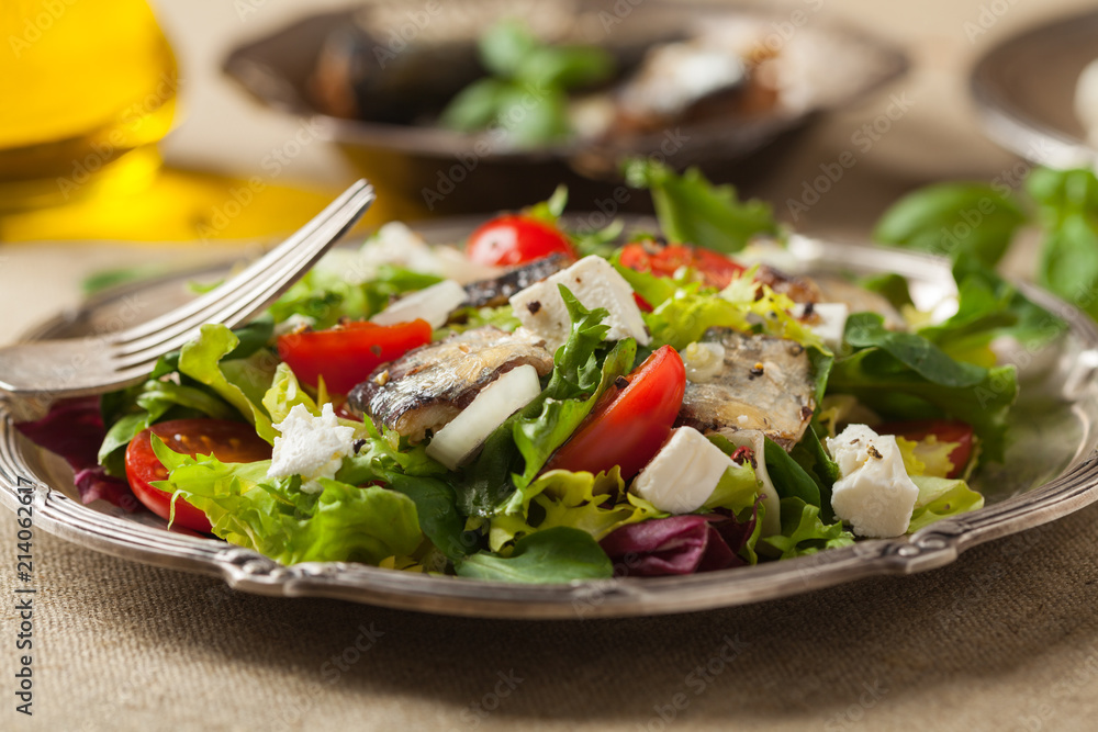 A delicious salad with sardines and feta cheese. A delicious salad with sardines and feta cheese.