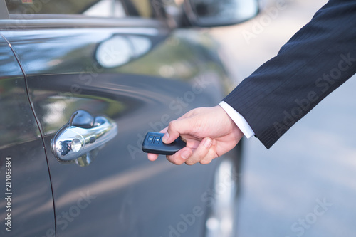Man in formalwear open car door, Hand on car door handle