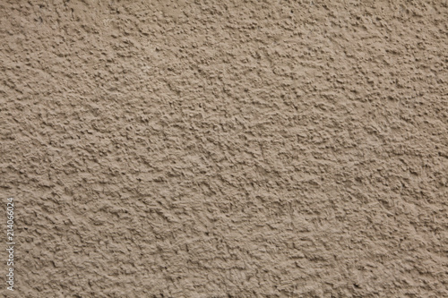 Dirty brown painted stucco wall. Background texture