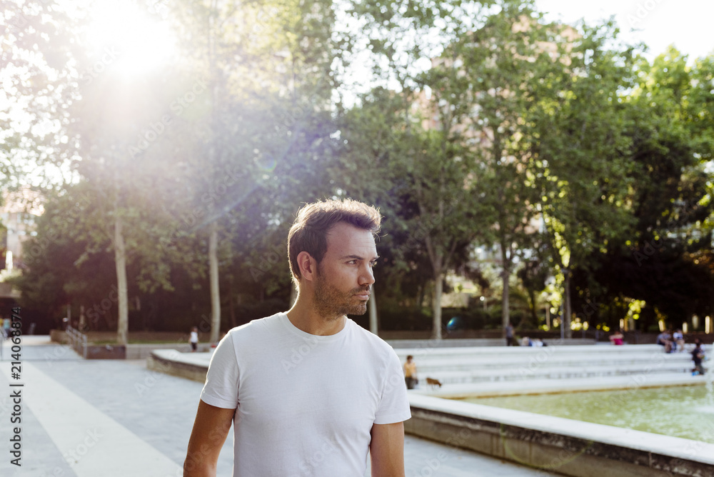 Cheerful man walking in park Cheerful man walking in park