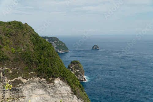 Seascape, rocky coast, ocean, blue sea, waves, Nusa Penida, Indonesia. Ocean with waves and rocky cliff Travel concept