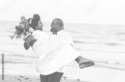 African American xouple getting married at the beach photo