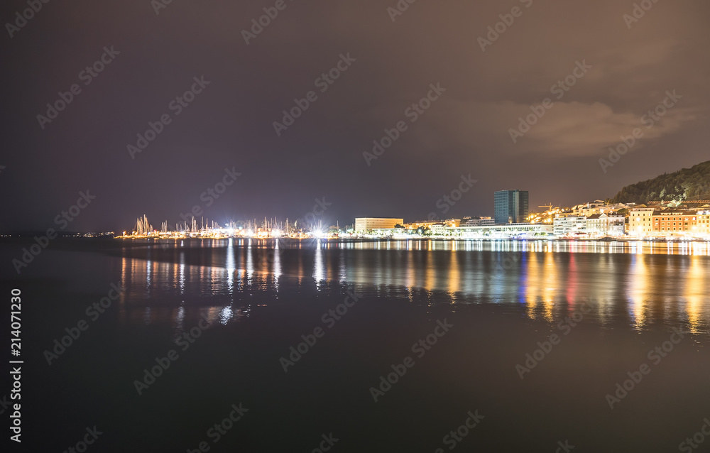 Beautiful view on the sea port and Marjan park in Split, Croatia at night.
