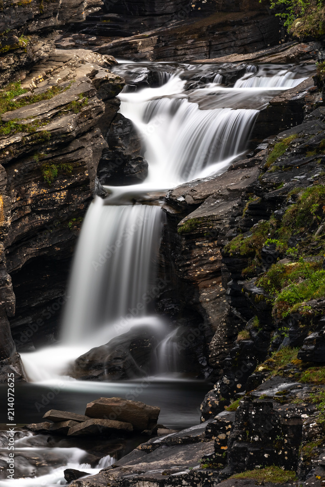 Obraz premium Beautiful cascade streaming in nature in Lyngenfjord, Norway.