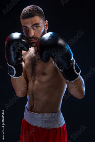 Double arm block. Boxing trainer showing defensive techniques. Combat sport, fight club. © nazarovsergey