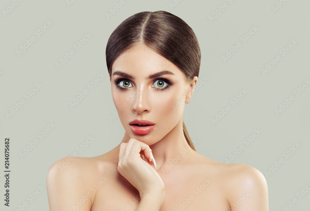 Surprised Woman Spa Model with Clean Fresh Skin and Blonde Hair on White Background Surprised Woman Spa Model with Clean Fresh Skin and Blonde Hair on White Background