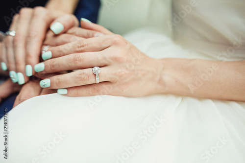 Groom holding bride s hand. Couple s hands.