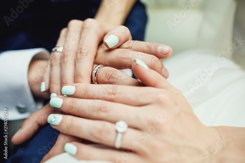 Groom holding bride s hand. Couple s hands.