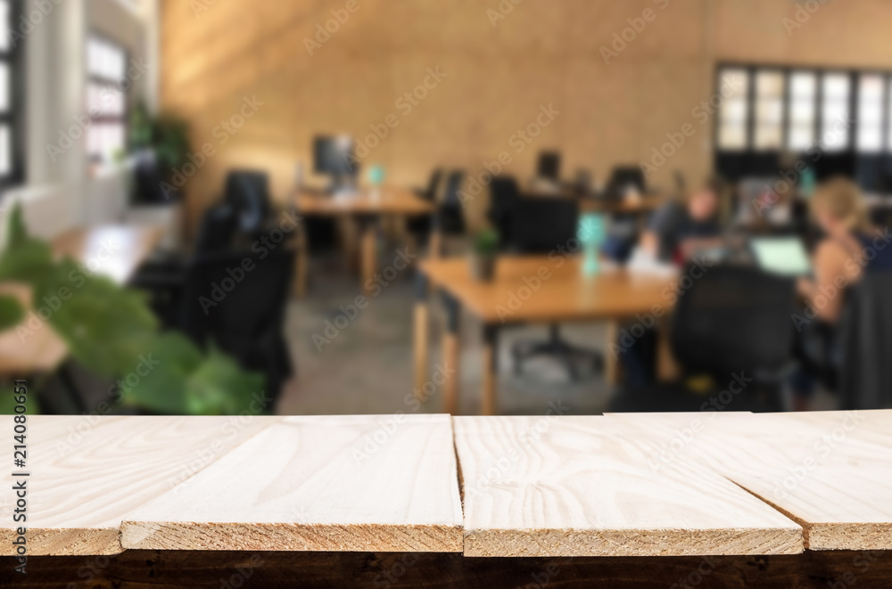 Selected focus empty brown wooden table in office with big windows of the Background with bokeh image. for your photomontage or product display Selected focus empty brown wooden table in office with big windows of the Background with bokeh image. for your photomontage or product display