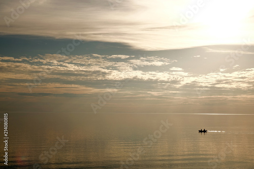 A small boat floats on the sea.