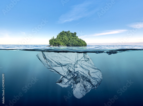 iceberg of garbage plastic with island floating in the ocean