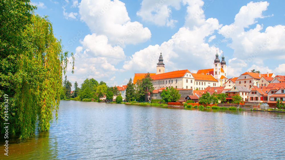 Fototapeta premium Telc Panorama. Water reflection of houses and Telc Castle, Czech Republic. UNESCO World Heritage Site.