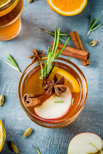 Tableau sur toile Traditional winter drinks, mulled wine cocktail with white wine, with spices, apple, orange