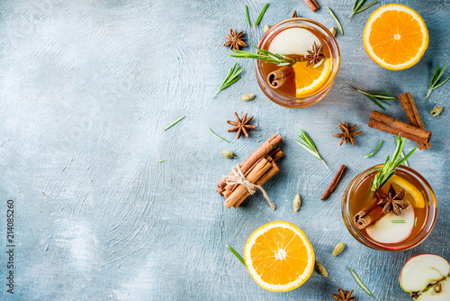 Bilde på lerret Traditional winter drinks, mulled wine cocktail with white wine, with spices, apple, orange