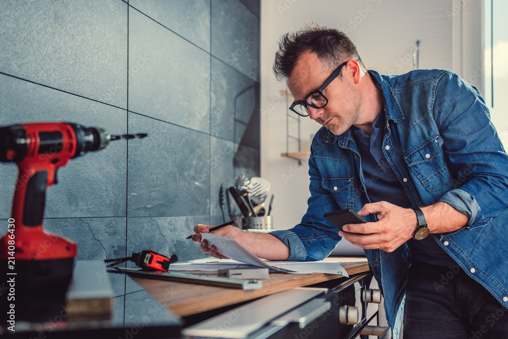 Architect using smart phone Architect using smart phone
