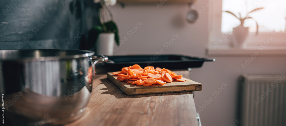 Sliced carrots on cutting board Sliced carrots on cutting board