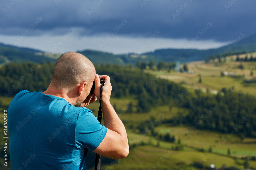 Tourist taking photos of landscapes Tourist taking photos of landscapes