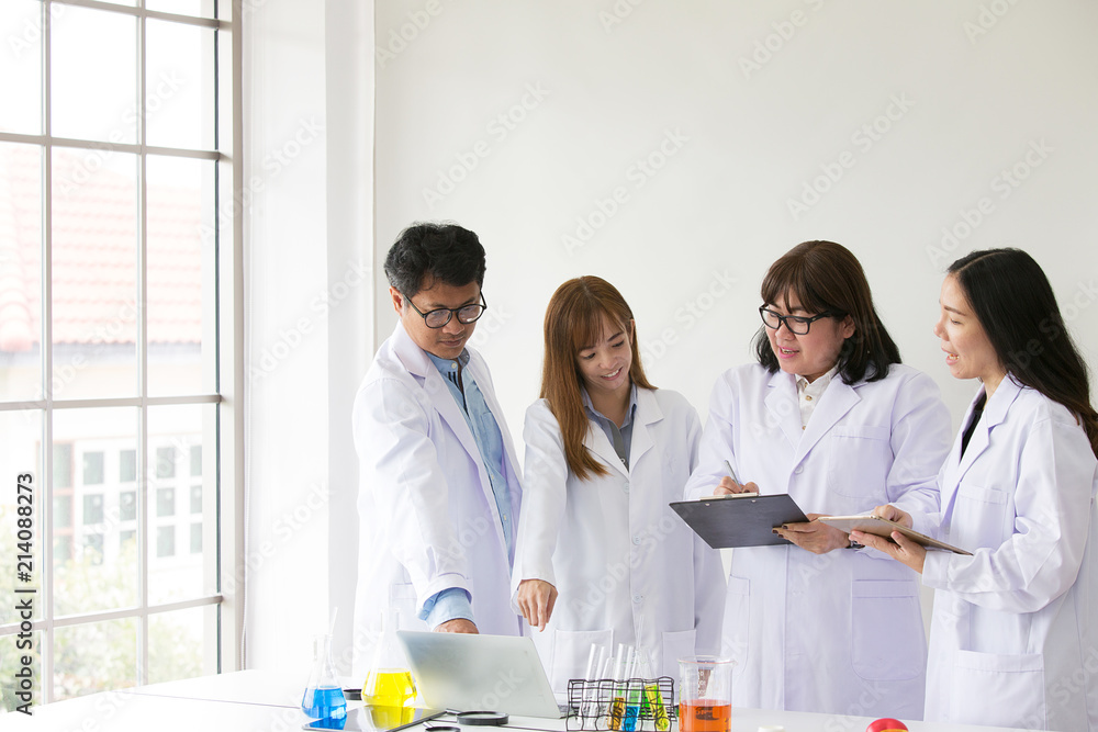 Sciene Test. Chemist scientific testing quarity. Group Scientist working at laboratory. One Man and Three woman at chemistry lab. Asian people. Sciene Test. Chemist scientific testing quarity. Group Scientist working at laboratory. One Man and Three woman at chemistry lab. Asian people.