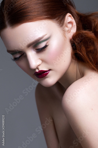 Beautiful young model with professional makeup  perfect skin  red lips