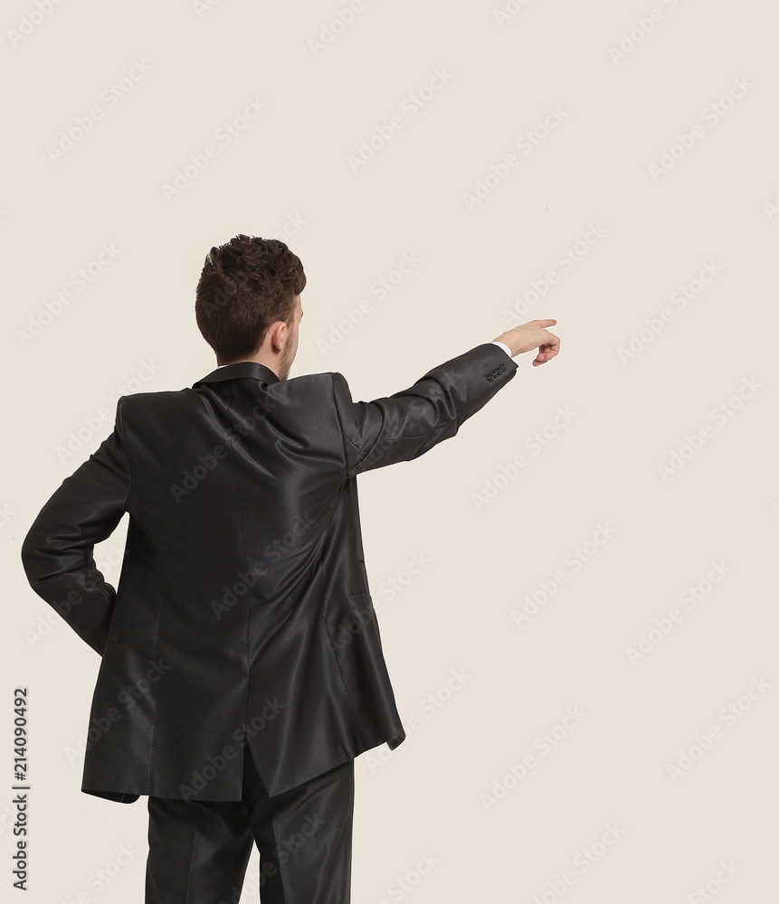 Full length of business man pointing at copyspace Full length of business man pointing at copyspace