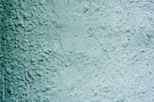 Background of a blue stucco coated and painted exterior, rough cast of cement and concrete wall texture