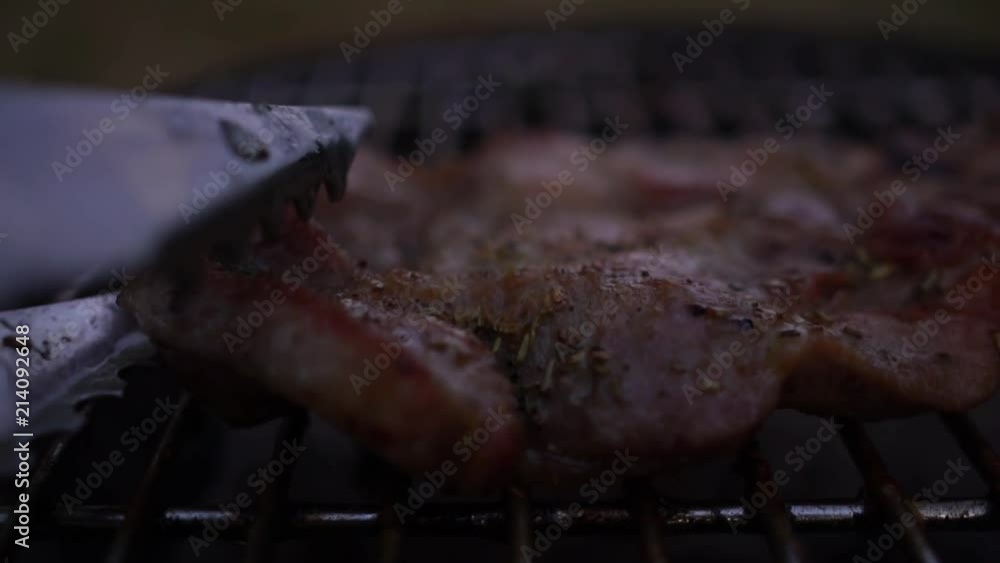 High quality video of steaks on the grill in slow motion High quality video of steaks on the grill in slow motion