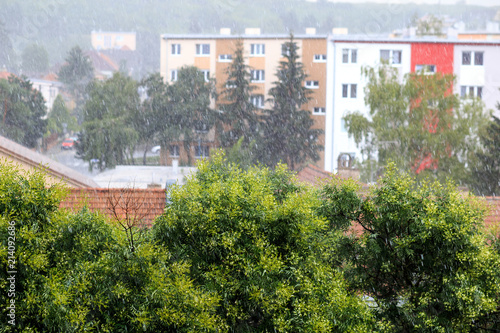 torrential rain in the city heavy spring summer rain