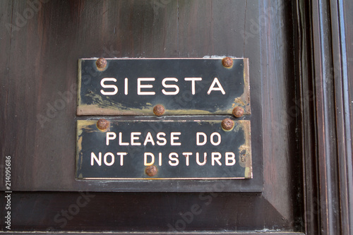 Siesta sign on the door photo