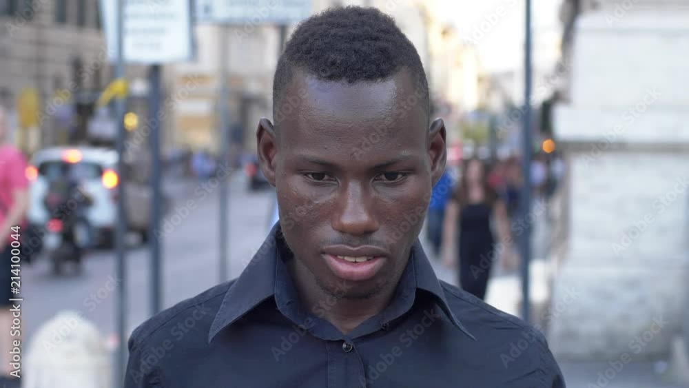 young African man will plug his ears and does young African man will plug his ears and does