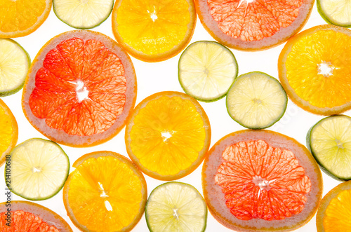 slices of citrus fruits on white background