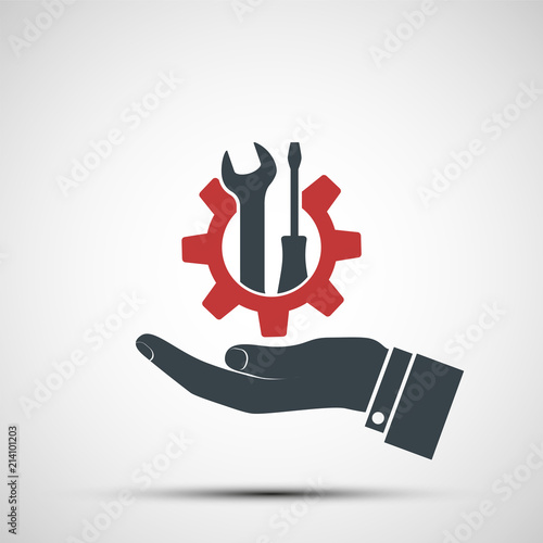 Logo hand holding gear with industrial tools wrench and screwdriver
