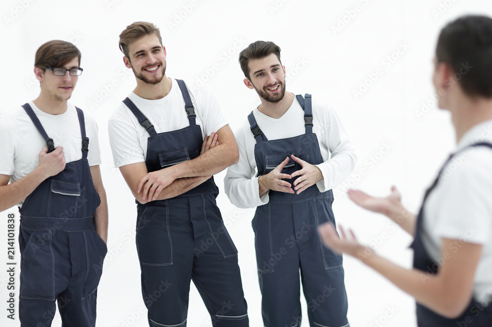 cheerful team of responsible movers and their smiling leader. cheerful team of responsible movers and their smiling leader.