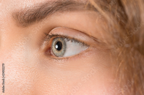 The close up eye on face of young beautiful caucasian girl