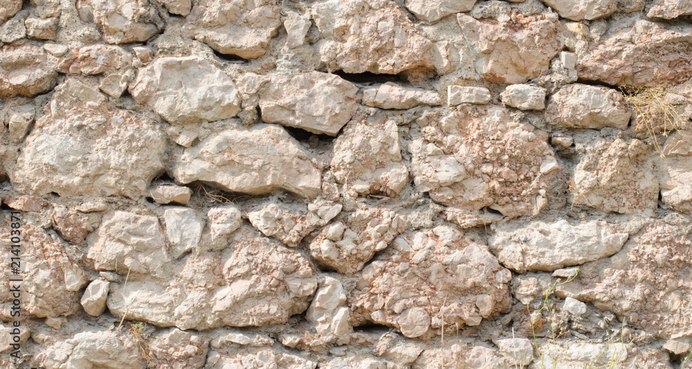 orange wall of a wild stone close up