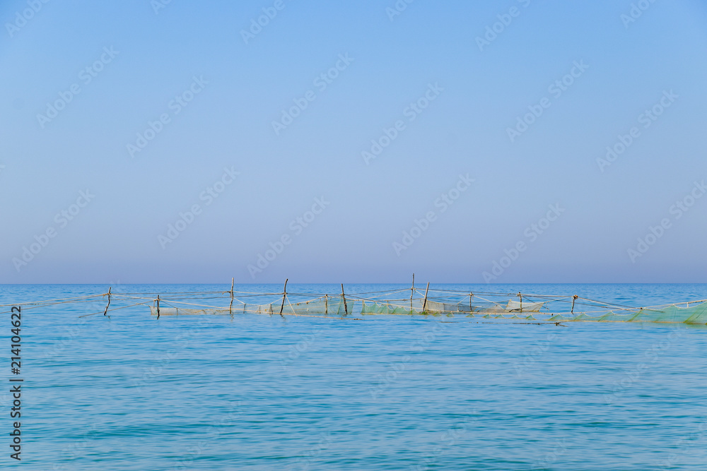 Fishing nets set in the sea. Fishing nets.