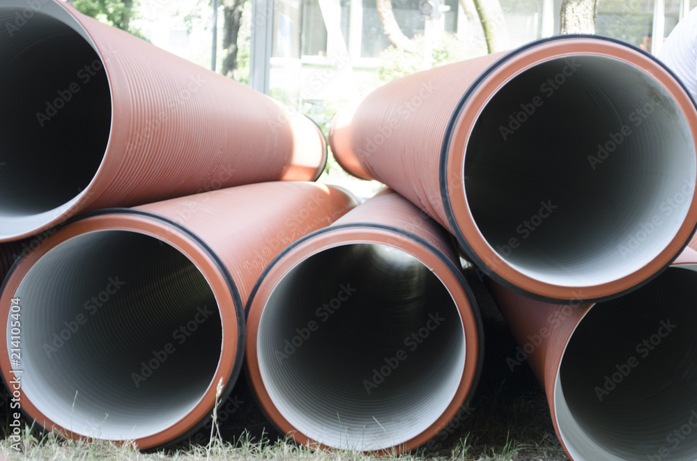 An image of plumbing tubes - stack. Plumbing tubes close-up.Plastic sewage corrugated flexible pipes An image of plumbing tubes - stack. Plumbing tubes close-up.Plastic sewage corrugated flexible pipes
